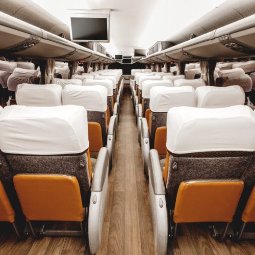 The brown seats of a modern airplane interior
