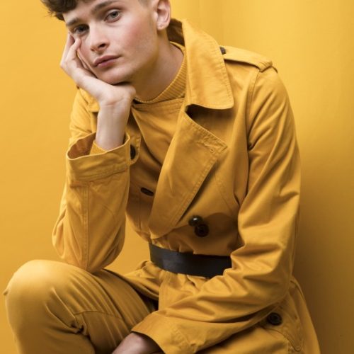 portrait-young-handsome-man-yellow-scene